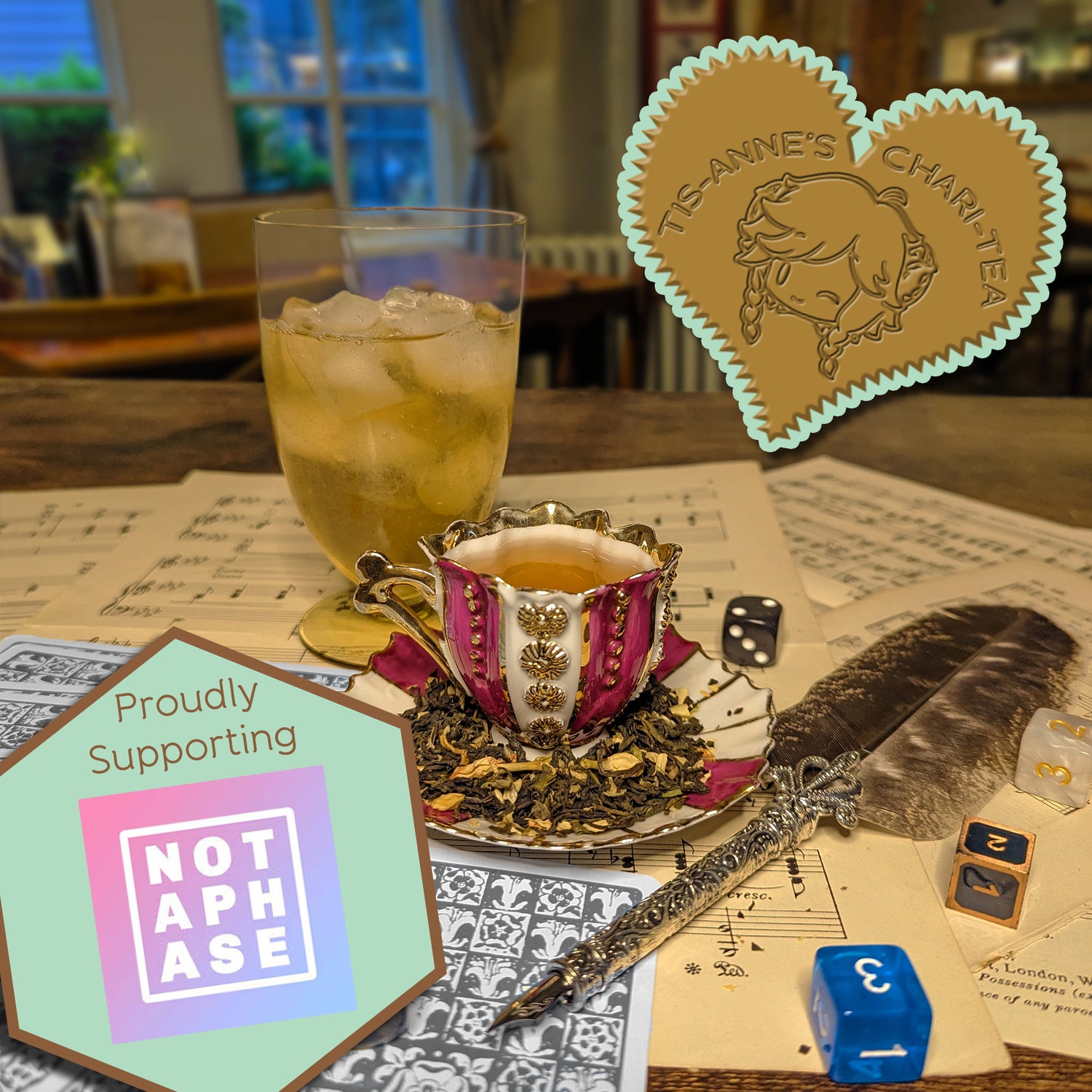 A striped and gilded teacup and saucer, next to a glass of iced tea, an elegant quill and sheet music. A heart-shaped badge in one corner reads "Tis-Anne's Chari-Tea", and another emblem reads "Proudly Supporting" with the Not A Phase logo.