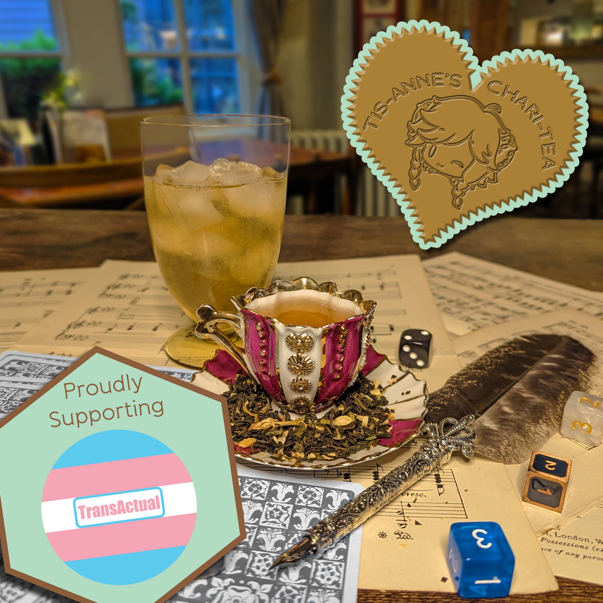 A striped and gilded teacup and saucer, next to a glass of iced tea, an elegant quill and sheet music. A heart-shaped badge in one corner reads "Tis-Anne's Chari-Tea", and another emblem reads "Proudly Supporting" with the logo for TransActual.