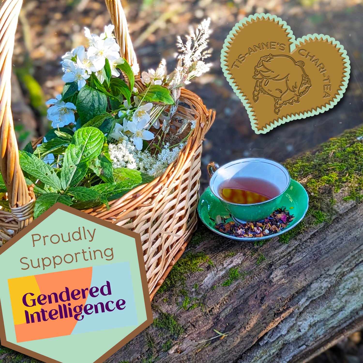 A green teacup and saucer on  a mossy log, next to a basket of wildflowers and leaves.
A heart-shaped badge in one corner reads "Tis-Anne's Chari-Tea", and an emblem in the other reads "Proudly Supporting Gendered Intelligence"