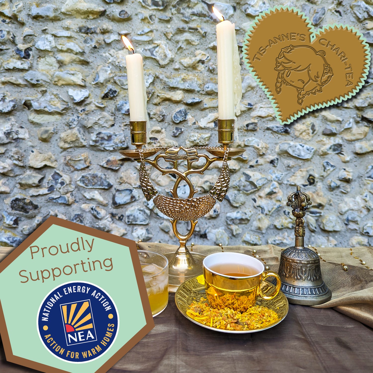 A golden cup of tea sits on a matching saucer, next to a glass cup of iced tea. A brass candlestick burns behind them.

A heart-shaped badge in one corner reads "Tis-Anne's Chari-Tea", and another emblem reads "Proudly Supporting" with the logo for National Energy Action.